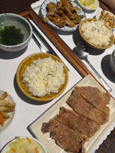 Lunch spread with rice, soup and fried pork chop
