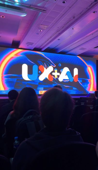 UX+AI on stage at a UX conference