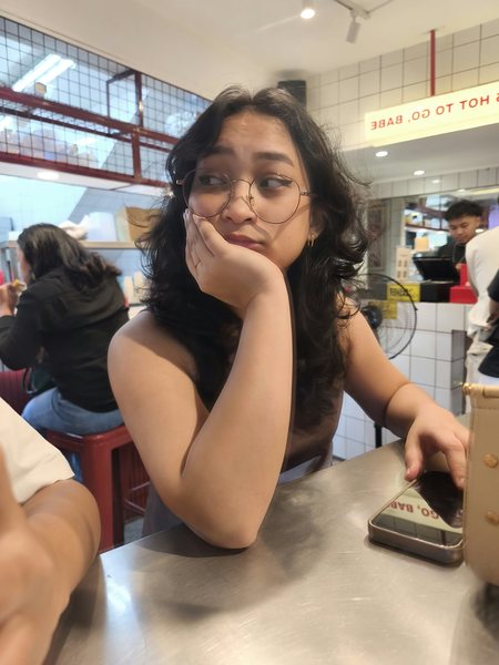 Me at a café, chin in hand